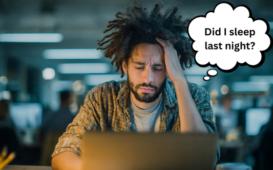 Image of a man at work trying to understand why he is always tired. 