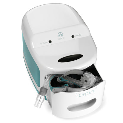 White and teal Lumin device with a mask on a white background