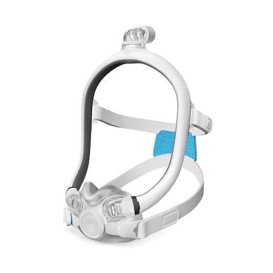 Angled product shot of the full ResMed AirTouch F30i Comfort mask system, featuring the white fabric frame, UltraCompact cushion, and headgear strap.