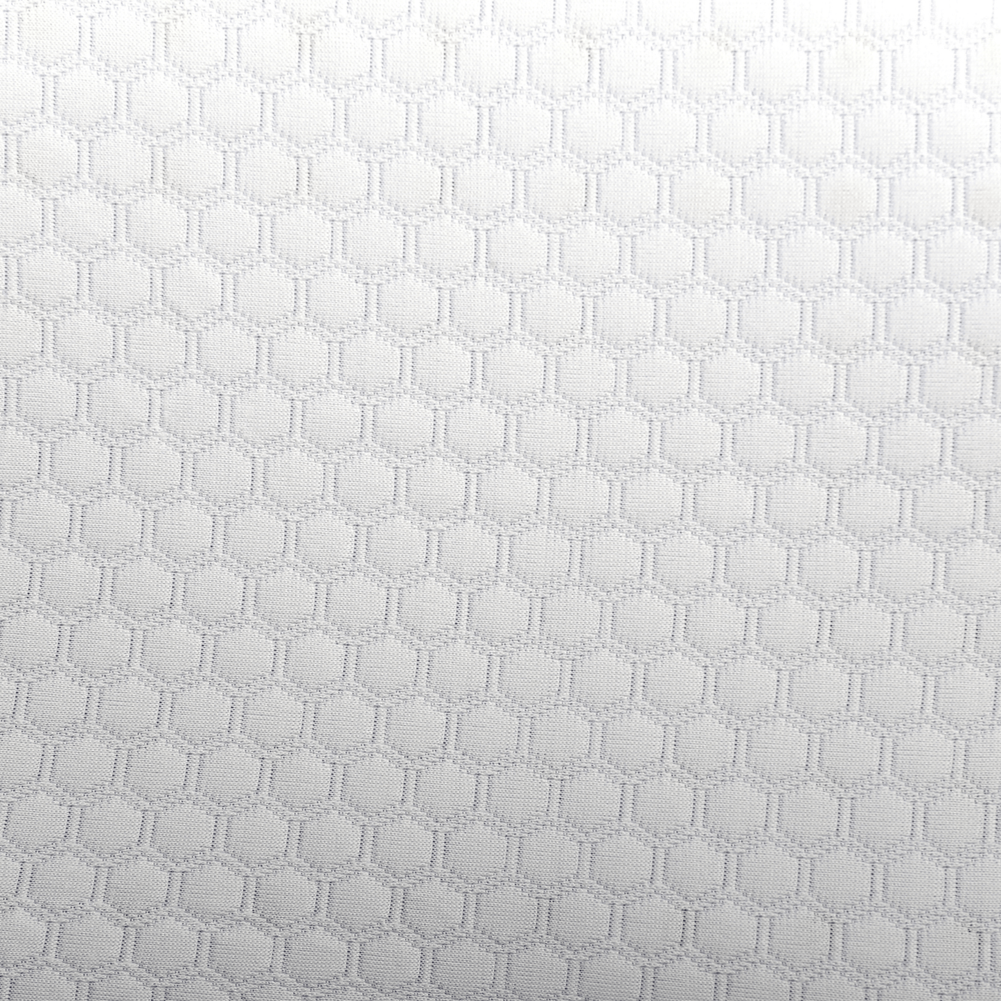 Close-up of the breathable, honeycomb-patterned white fabric cover on the CPAP Soap Adjustable Pillow.