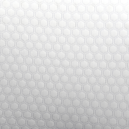 Close-up of the breathable, honeycomb-patterned white fabric cover on the CPAP Soap Adjustable Pillow.