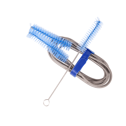 CPAP Soap CPAP Tube Cleaning Brush coiled and secured with blue velcro strap in compact storage position, short connector brush extended to the side, on white background