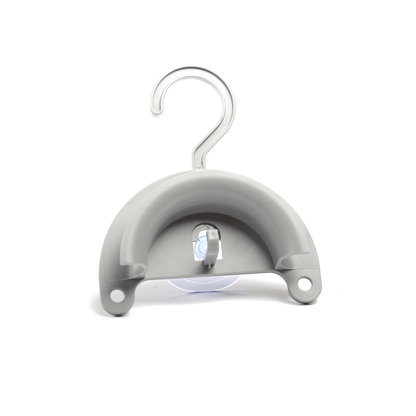 CPAP Soap hose hanger showing top hook for shower rod mounting and suction cup on the flat base for smooth surface mounting