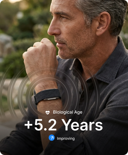 Man wearing a hume 2 band with text indicating a 'Biological Age +5.2 Years' and 'Improving' status.