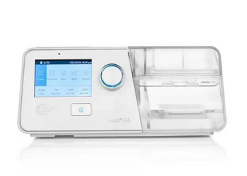 White CPAP machine with digital display on a white background