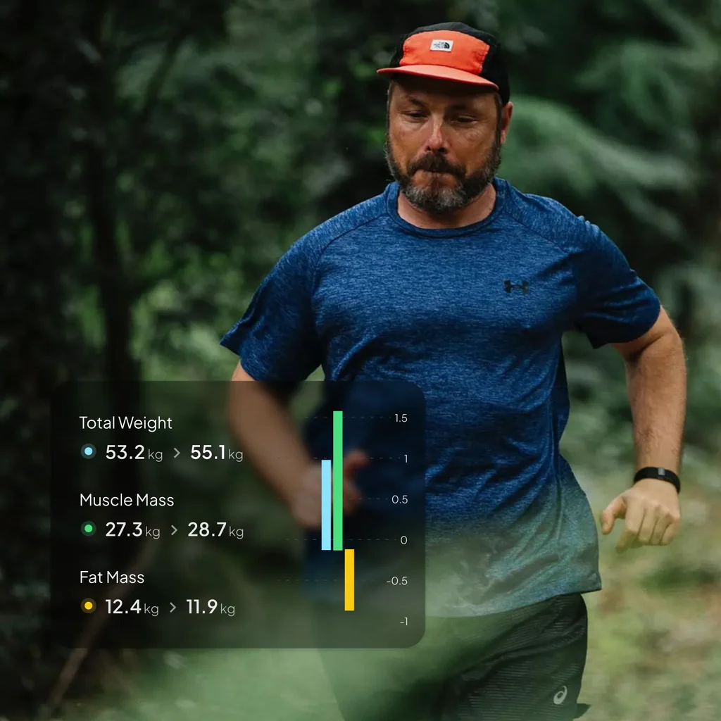 A man jogging with the Hume 2 band and the health stats in the foreground. 