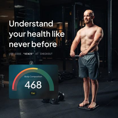 Man standing on a scale with body composition results displayed, in a gym setting.