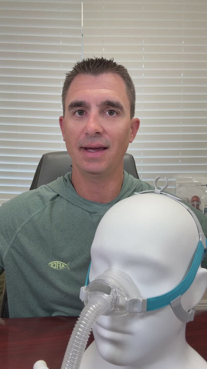 Product feature video for the Fisher & Paykel Nova Nasal CPAP mask. The video highlights its compact design, featuring a 360-degree swivel, a top-of-head tube clip for active sleepers, and a removable quiet-flow diffuser. It showcases the mask's stability and its soft "floating" nasal cushion designed to reduce pressure on the bridge of the nose.