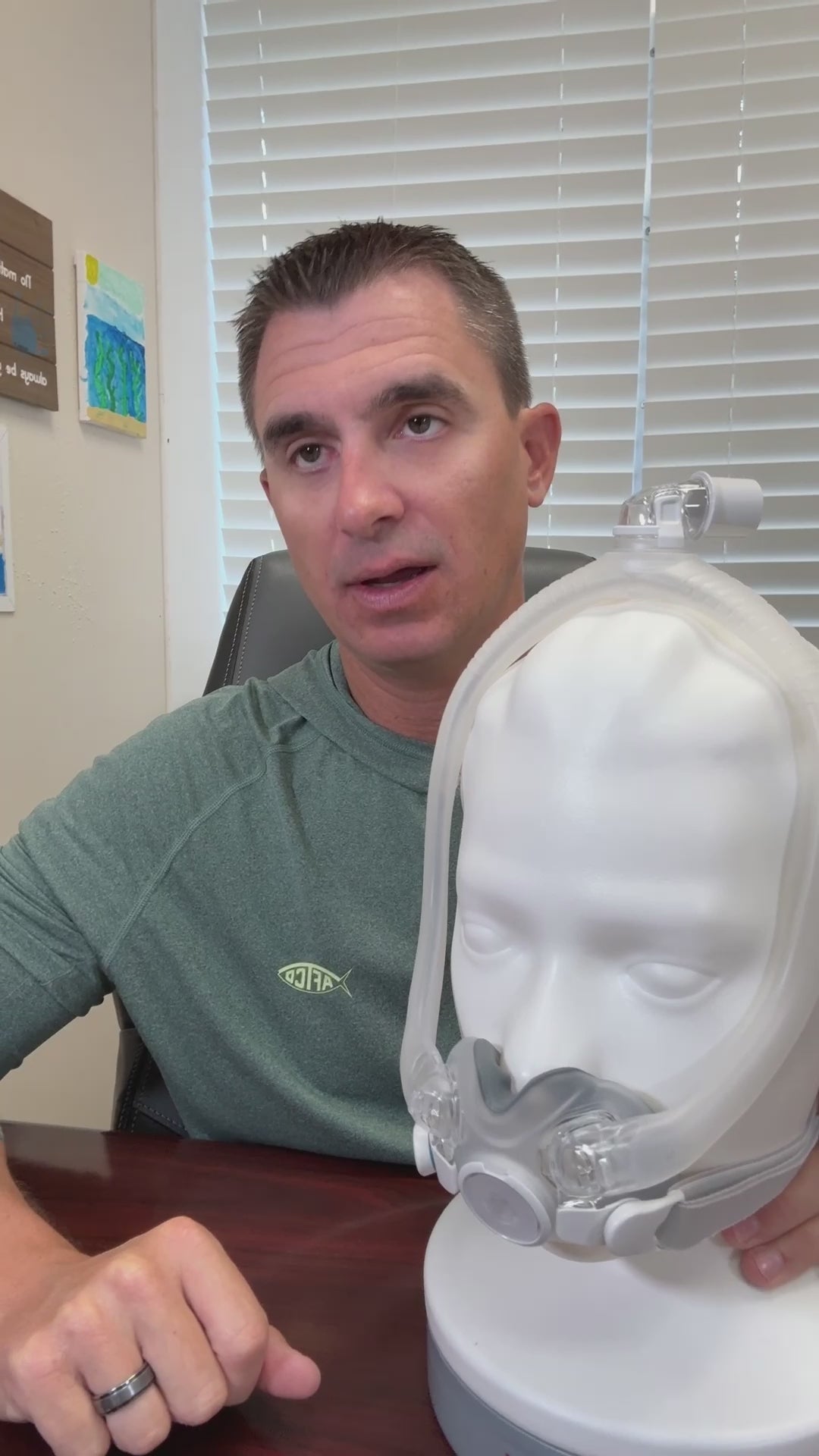 A feature showcase of the ResMed AirTouch F30i full face CPAP mask. The video highlights the hybrid ComfiSoft cushion with a fabric-fused seal, the hollow frame design for top-of-head hose connection, and the QuietAir venting technology. It demonstrates the mask's clear frame and under-the-nose fit that leaves the bridge of the nose free and provides an open field of vision.