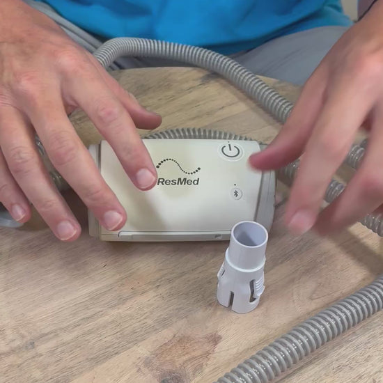 Hooking up the AirMini travel CPAP to the Slim CPAP tube with the AirMini Universal Tube Connector. 