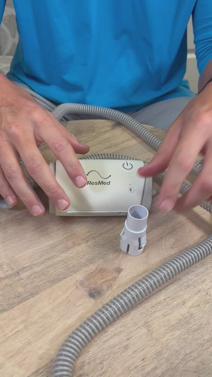 Hooking up the AirMini travel CPAP to the Slim CPAP tube with the AirMini Universal Tube Connector. 