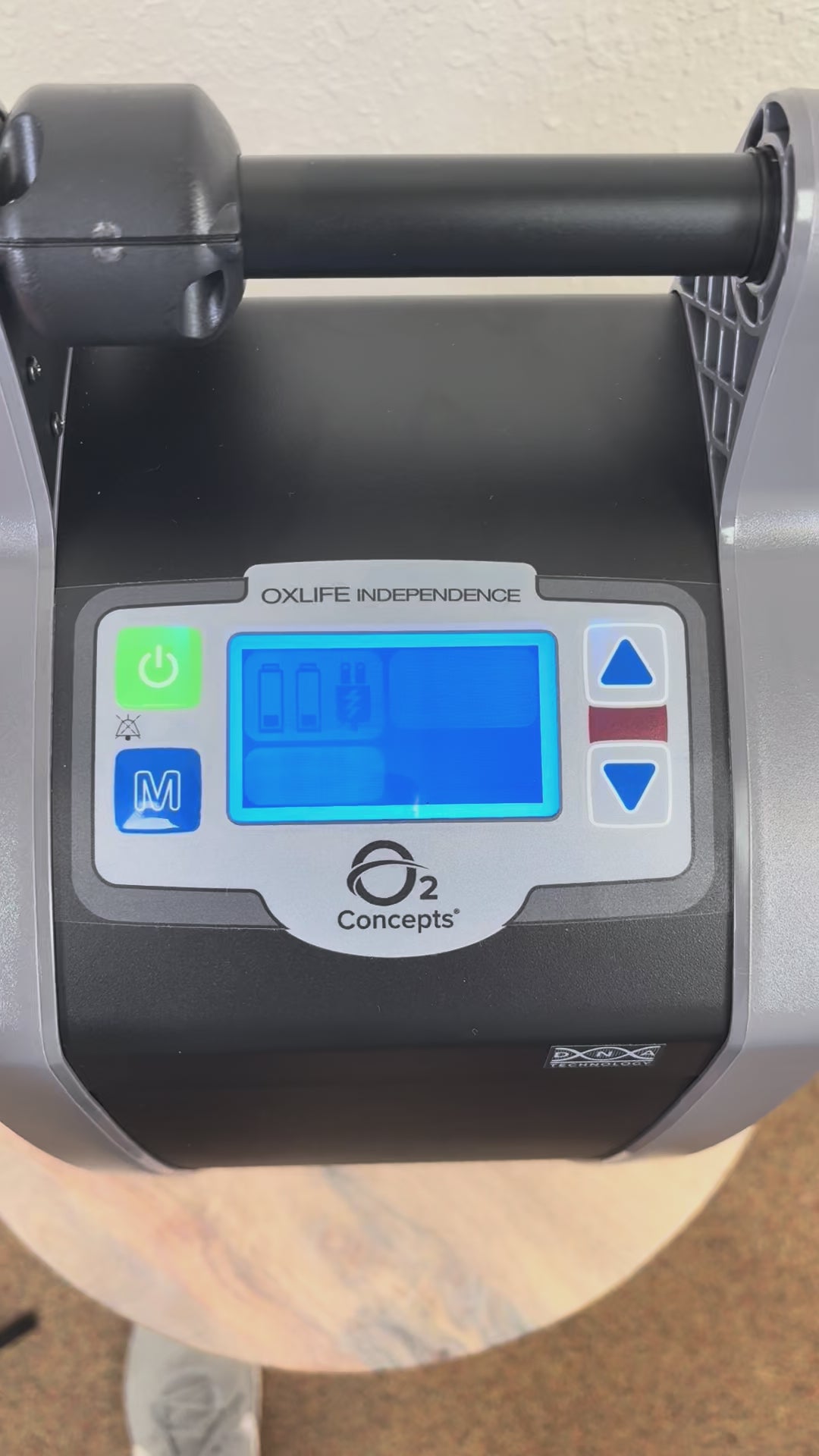 Demonstration of the adjustments on the O2 Concepts Oxlife Independence Portable Oxygen Concentrator. Mode, liter adjustment and power controls. 